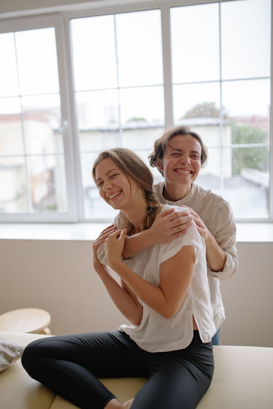 Smiling female patient with her physiotherapist