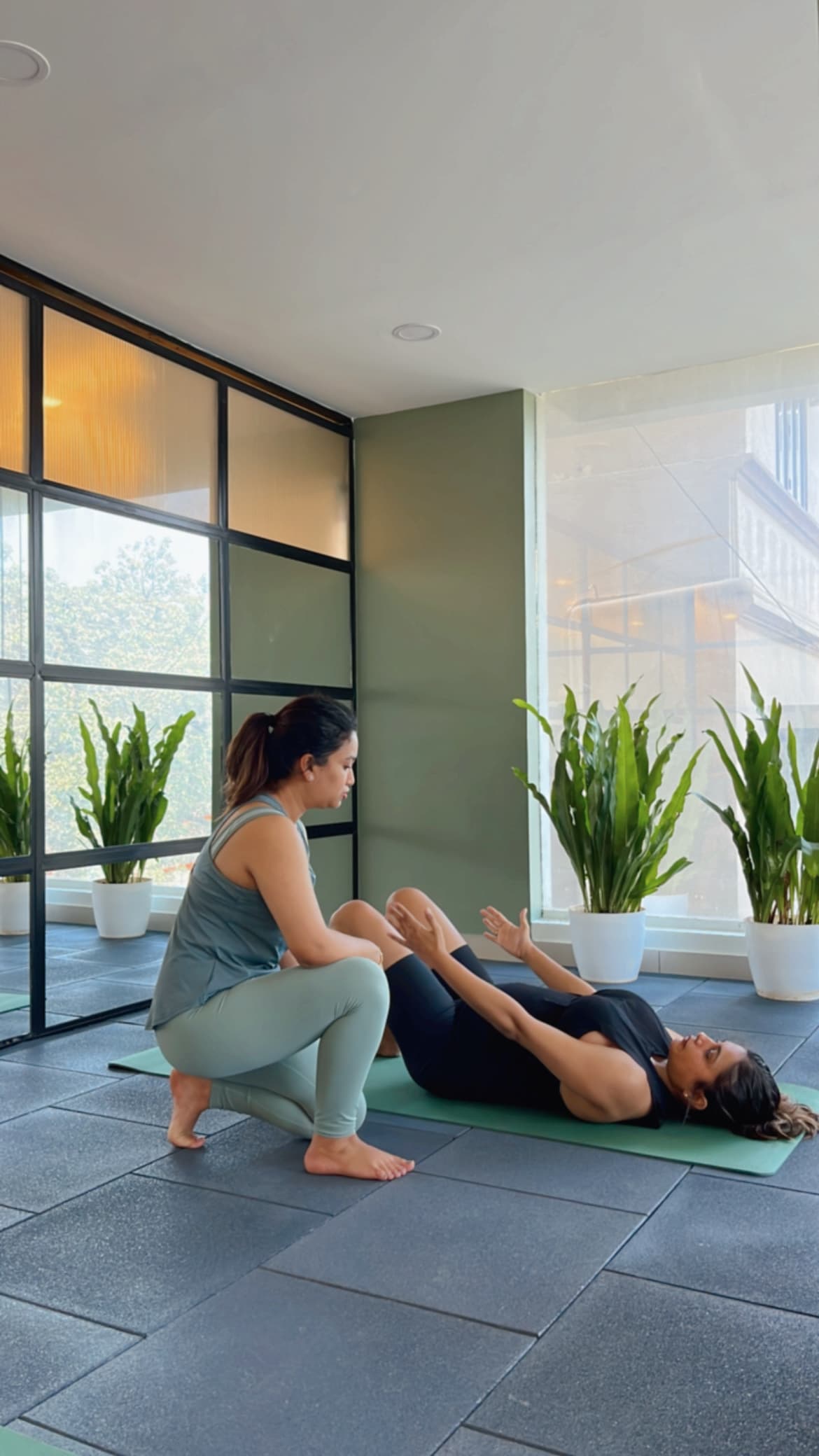 Physiotherapist guiding a patient's arm movement