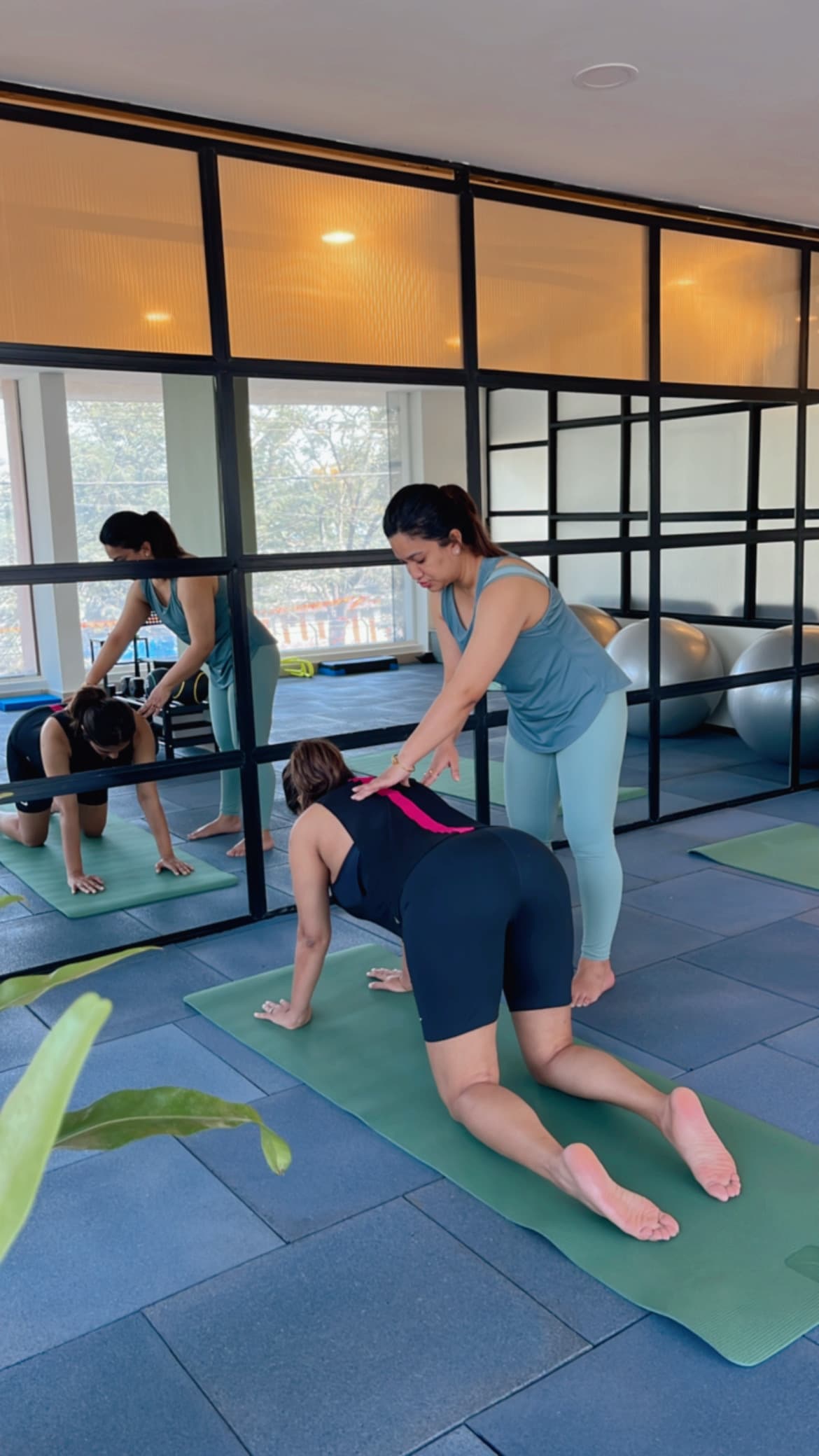 Physiotherapist stretching a patient's leg during sports rehab